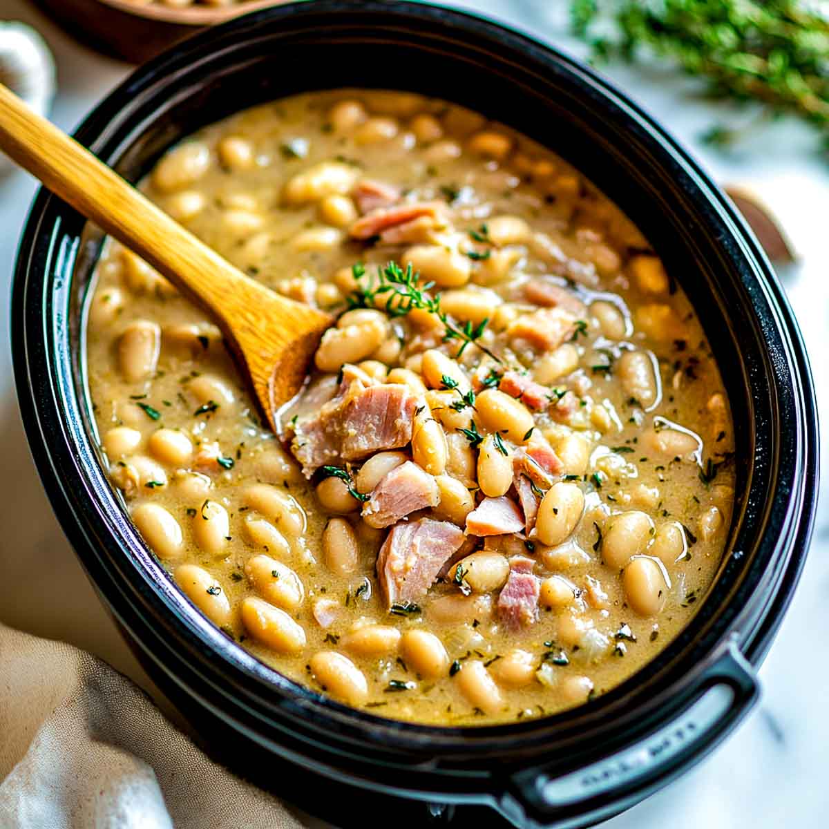 White bean and ham cooked in a crockpot.