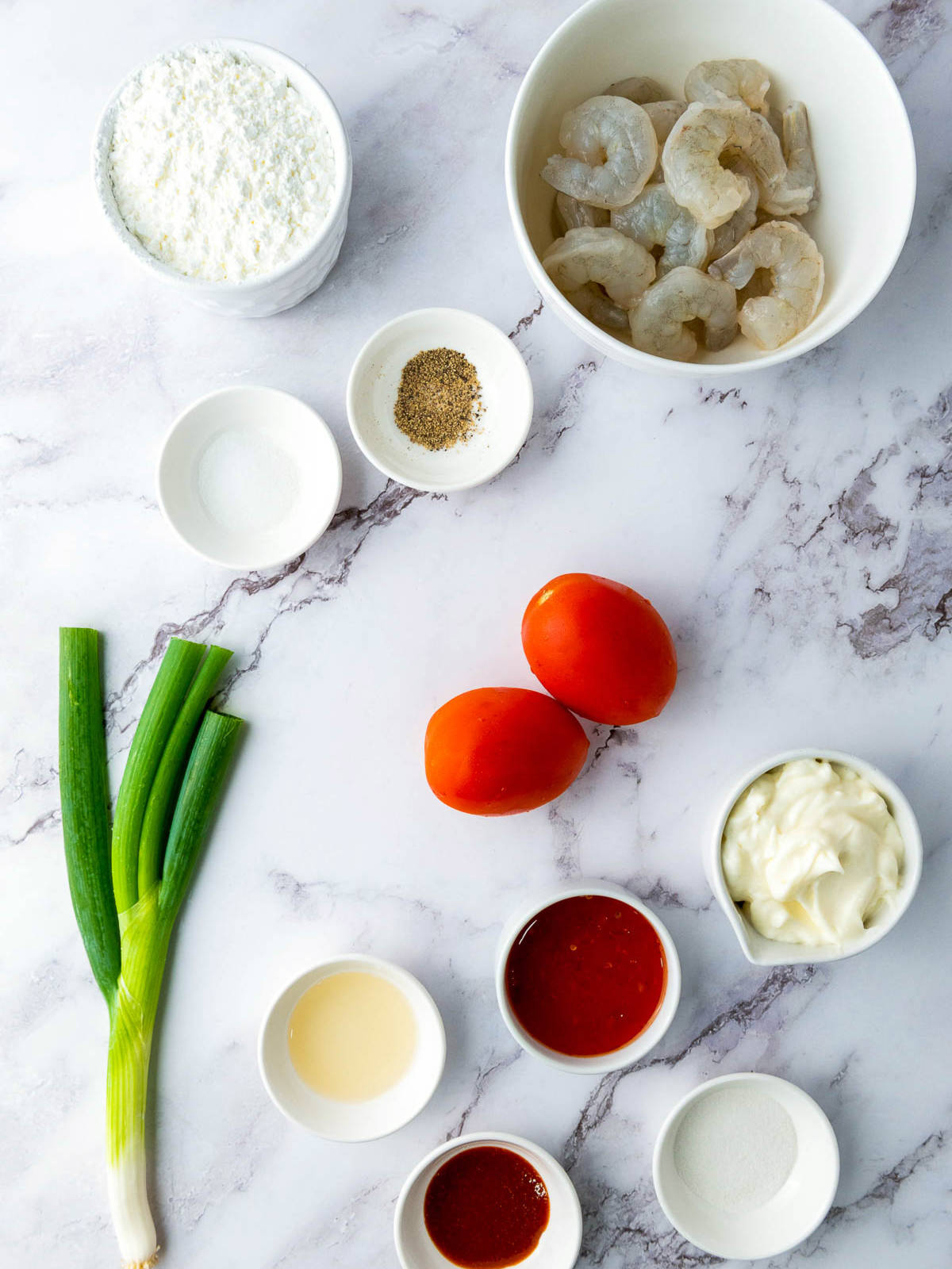 Ingredients placed on a marble surface.