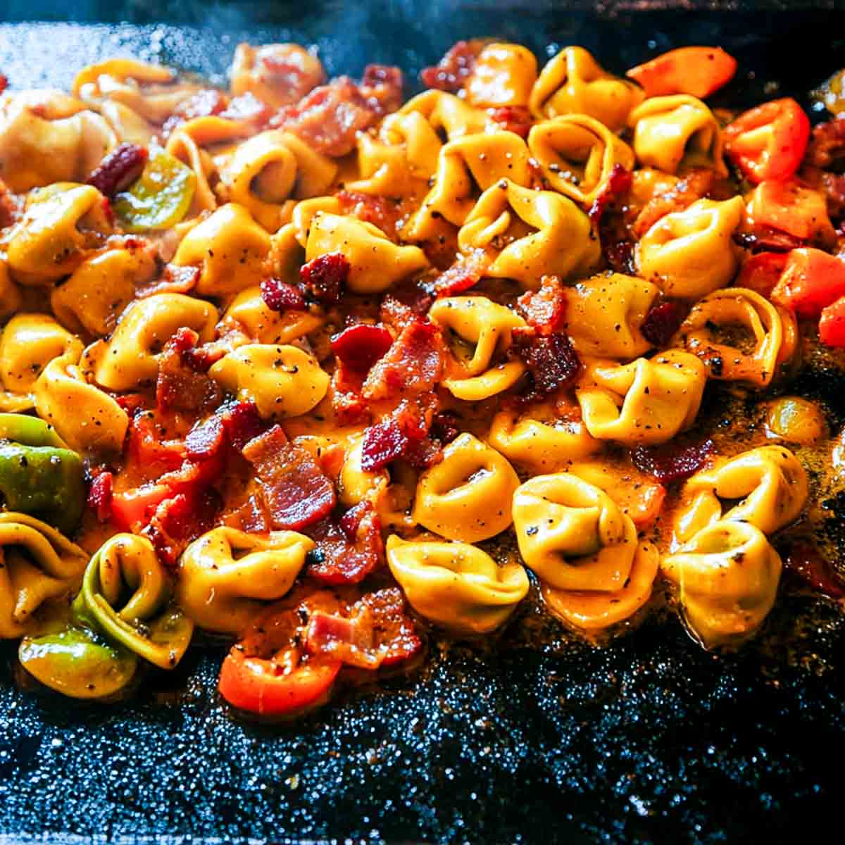 Campfire cheese tortellini with garlic butter.