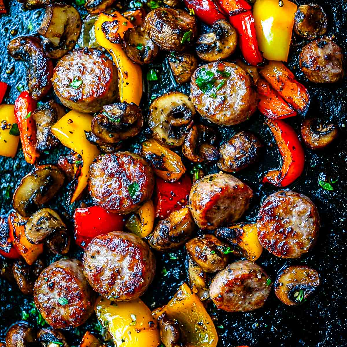 Close up of sausages and peppers.