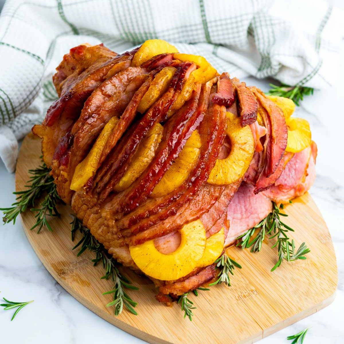 Ham placed on a wooden board.