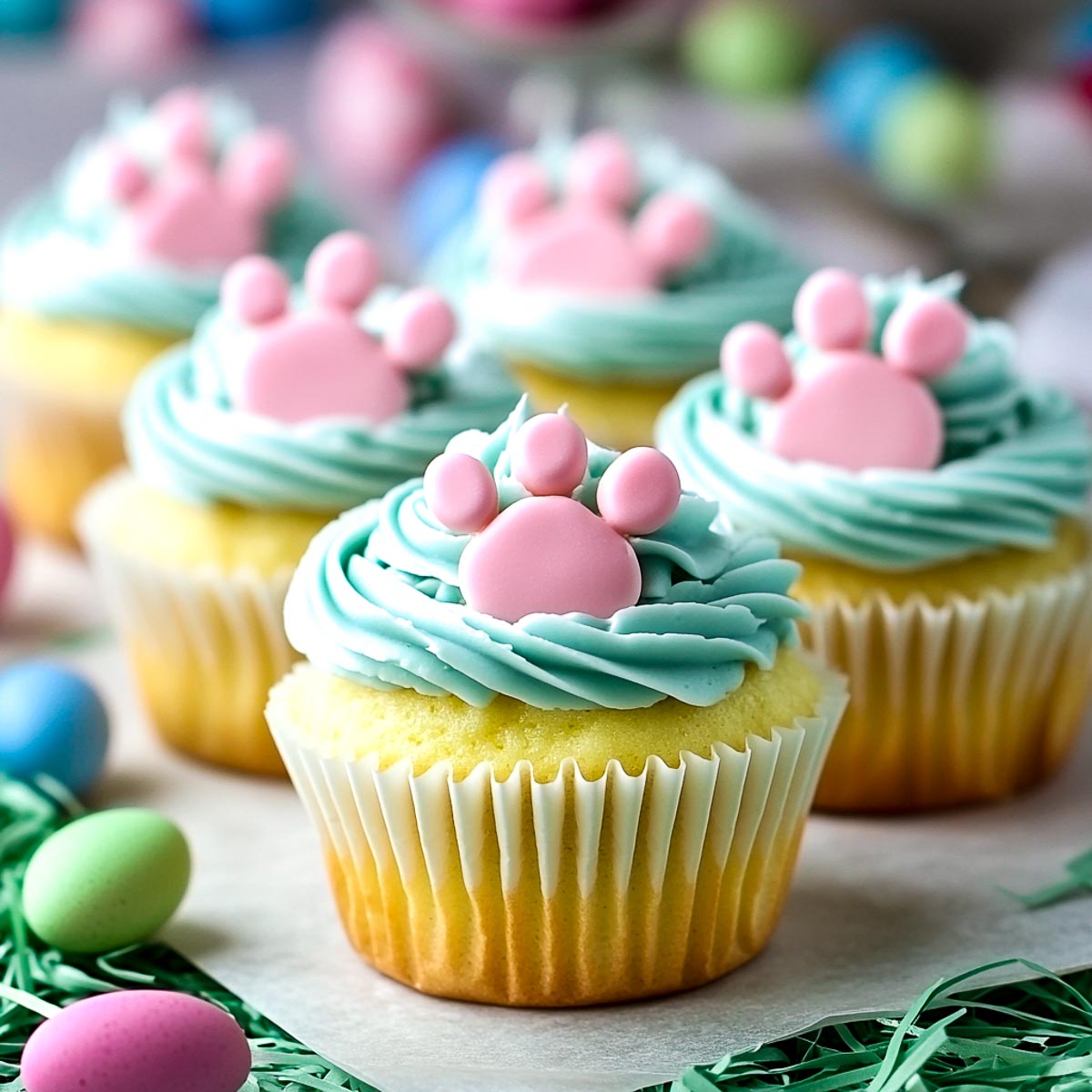 Fontant cut into paw shapes and placed on the frosting.