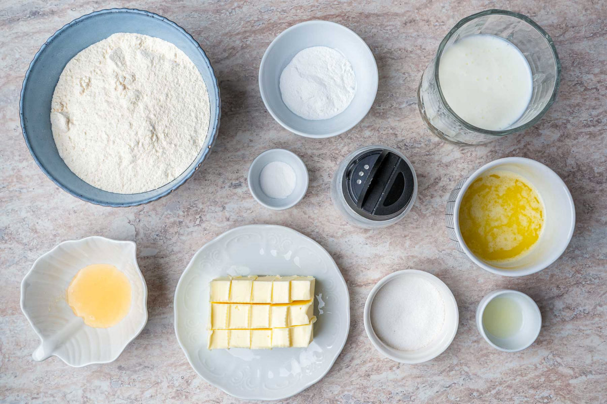 Ingredients placed in individual bowls on a wooden surface.