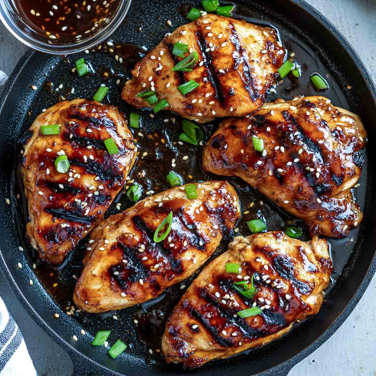 Teriyaki miso chicken on a grill pan.