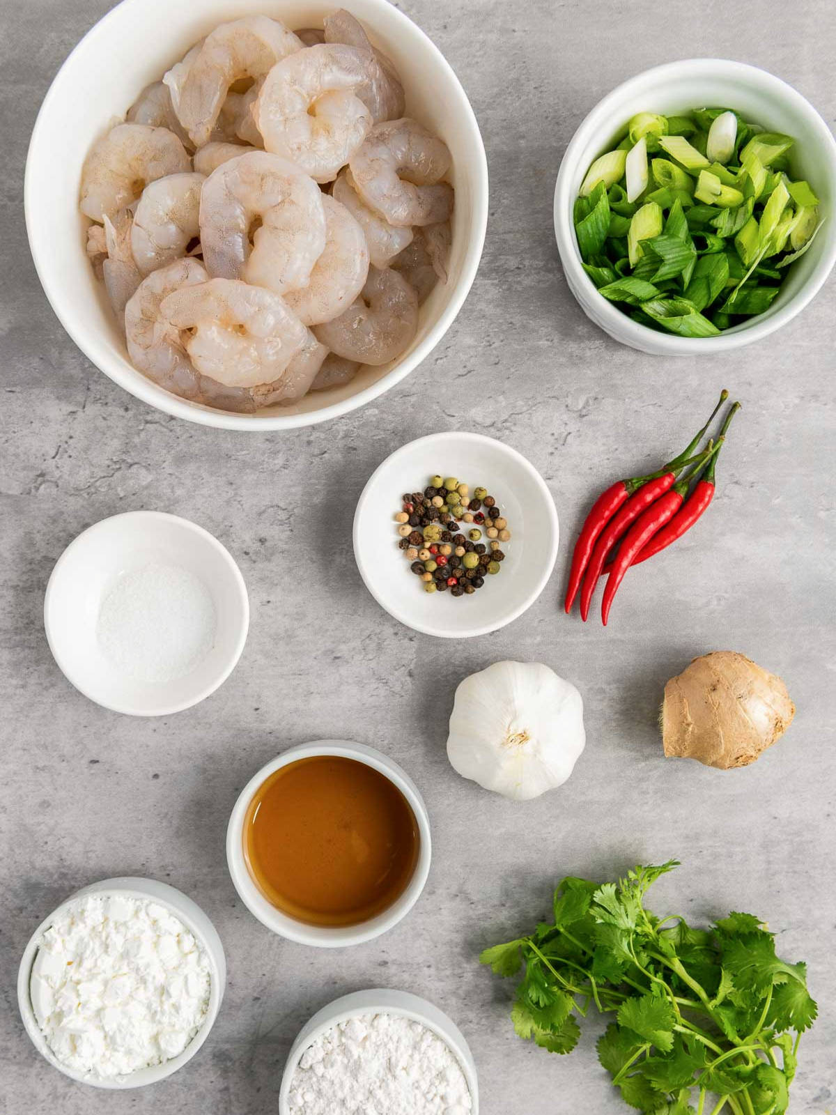 Ingredients placed on a grey surface.