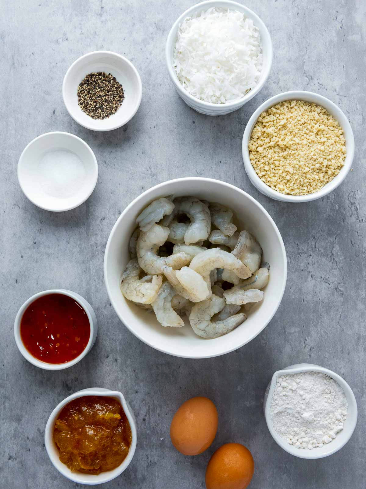 Ingredients placed on a grey surface.