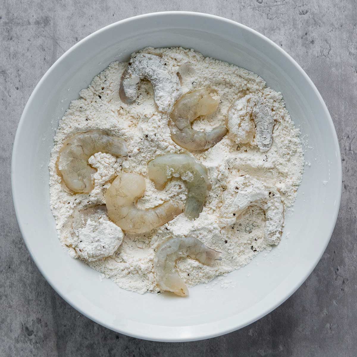 Shrimp dreched in flour.
