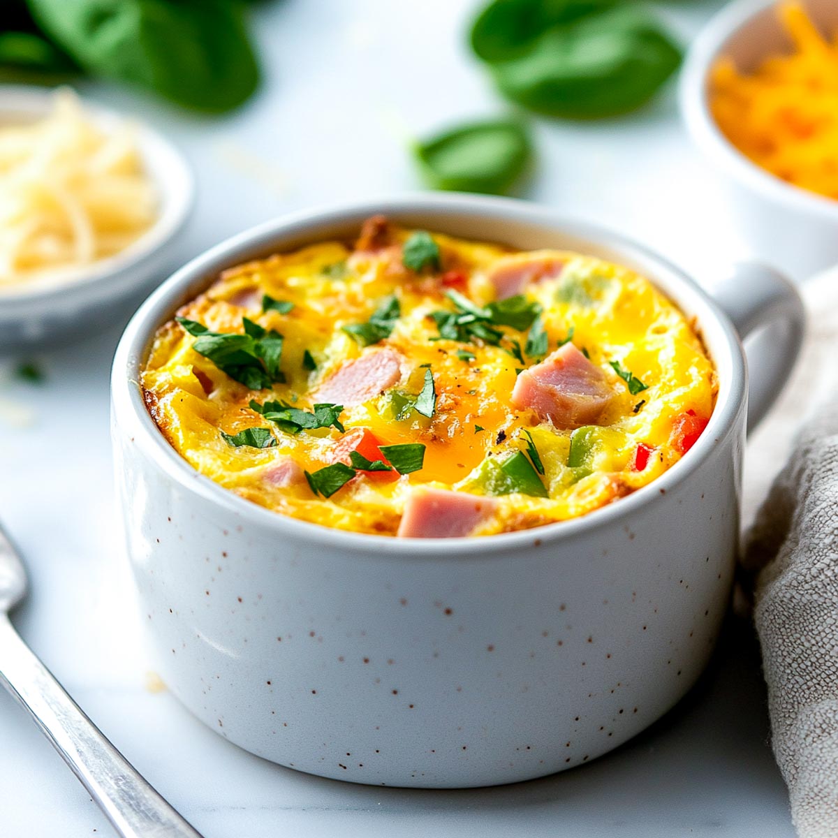 Mug frittata with ham and cheese.