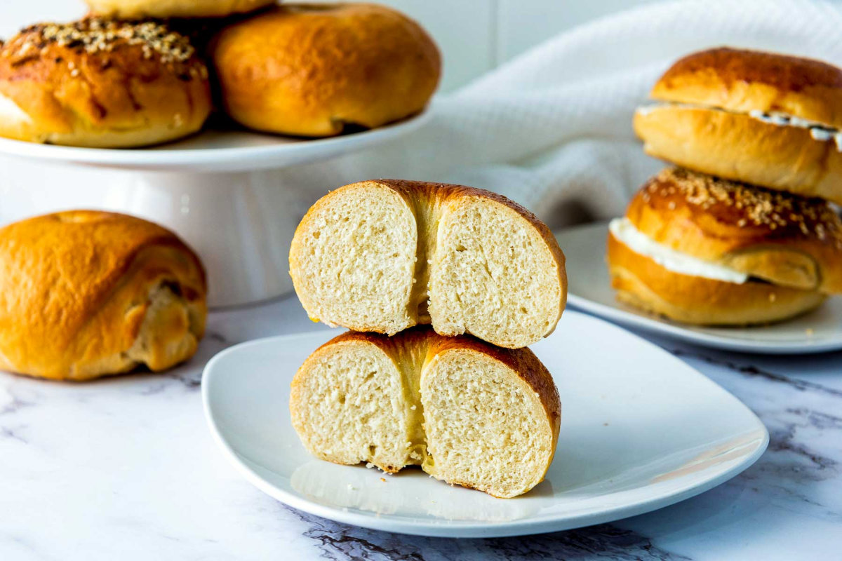 A bagel cut vertically to show the crumbs.