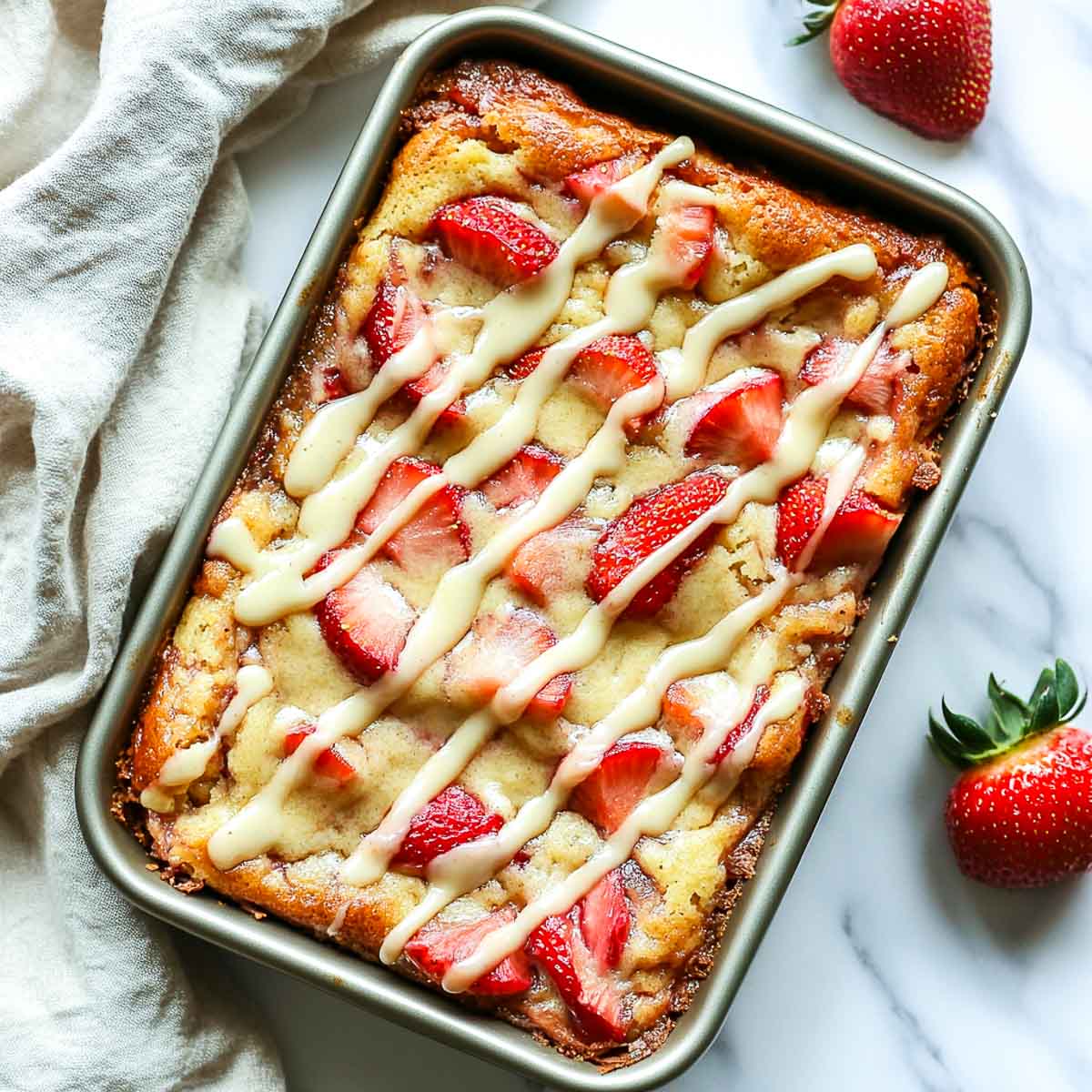 Keto rhubarb cake baked in a rectangle cake tin.