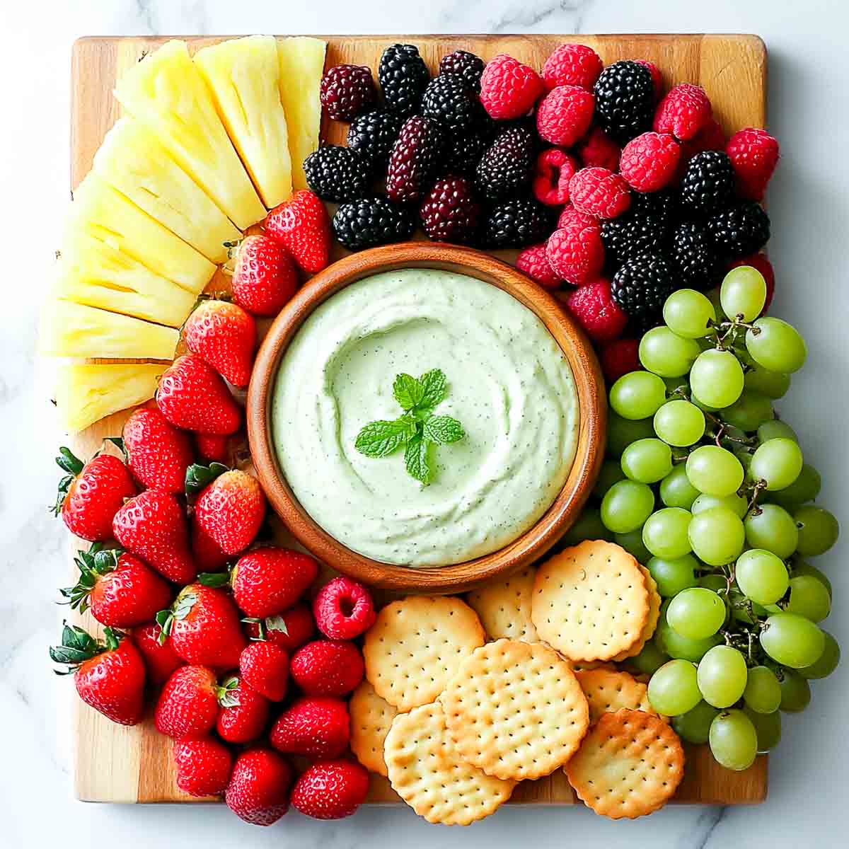 Assorted fruits served with mint dip.