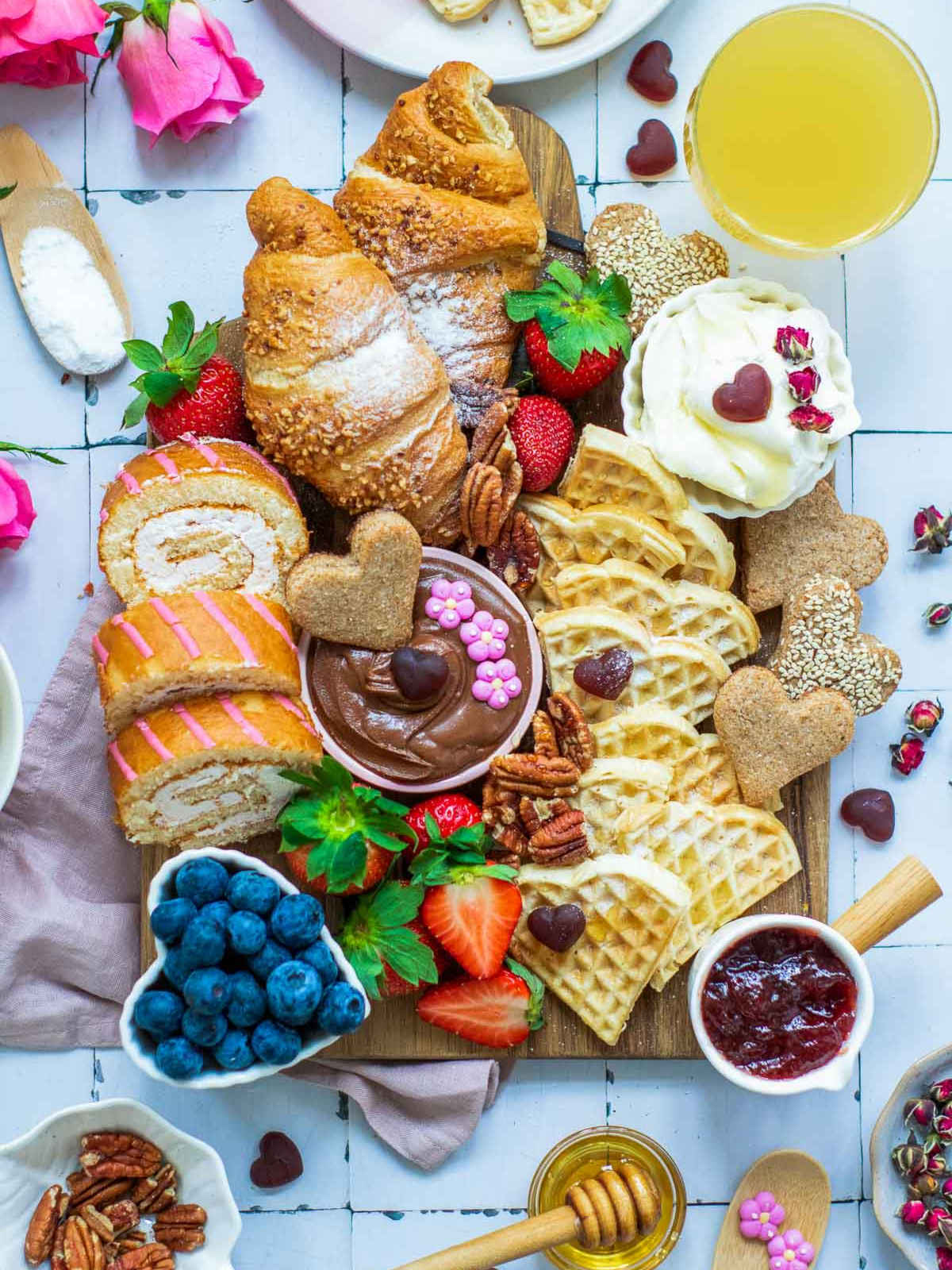 Mother's day breakfast board on a white surface.