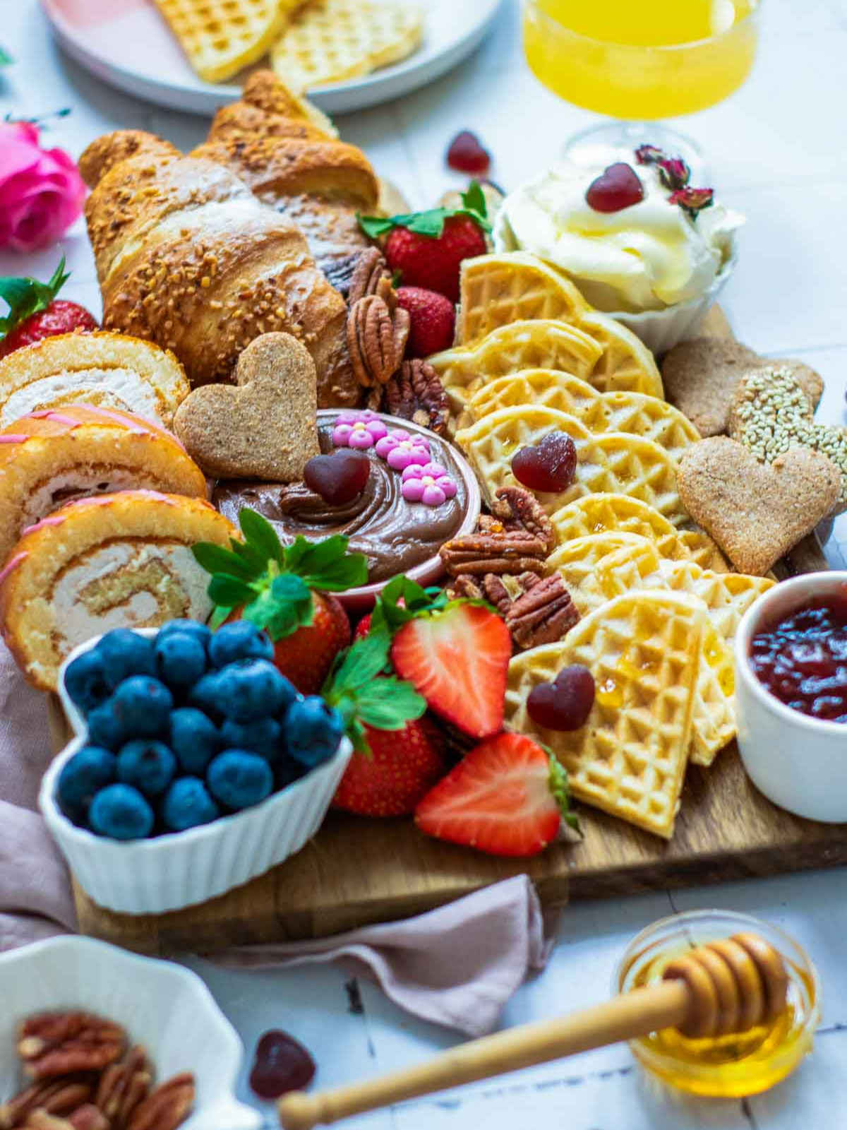 Breakfast spread served with orange juice.