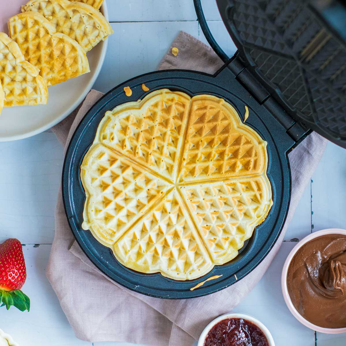 Waffles made in a heart-shaped waffle maker.