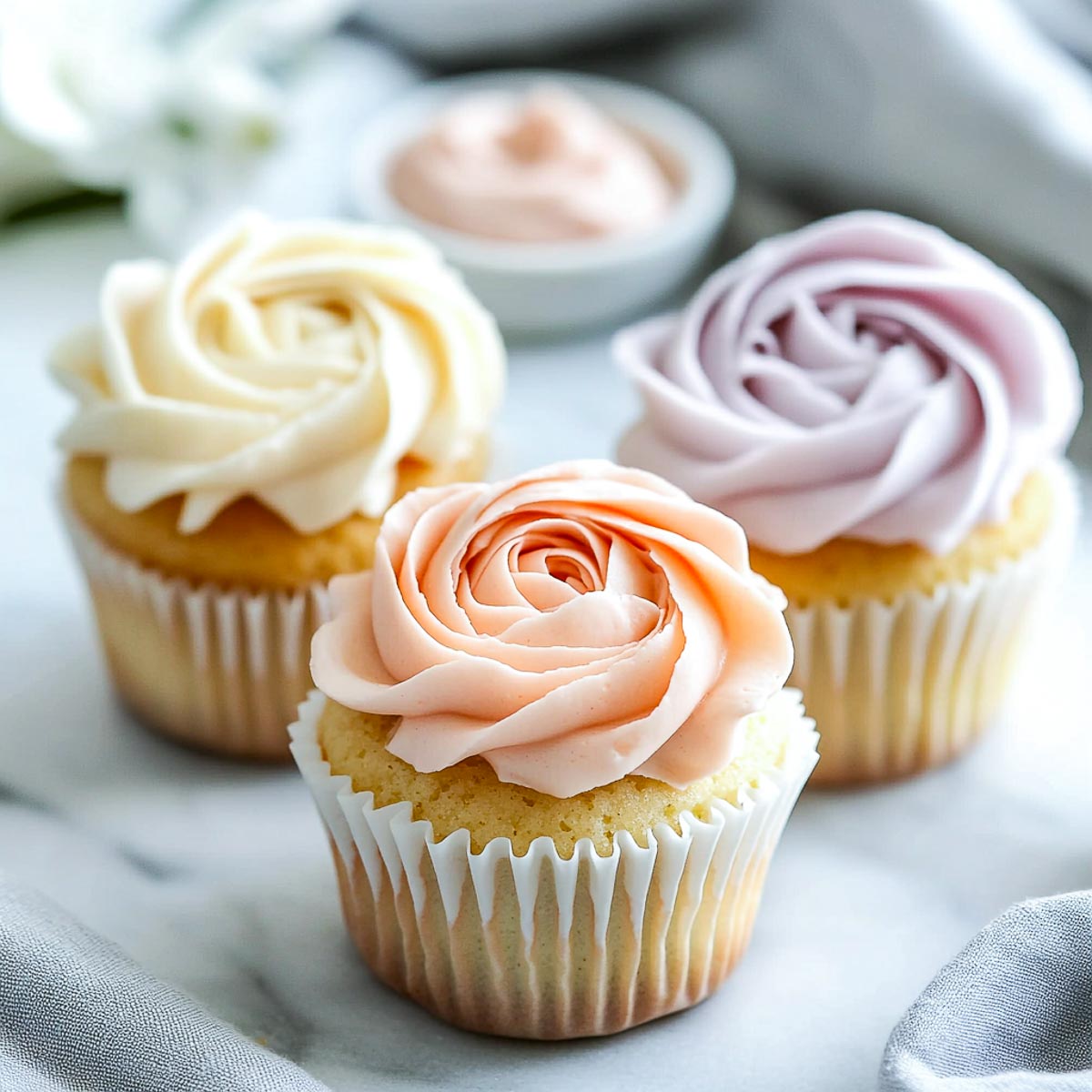 Cupcakes with rose swirl frosting.