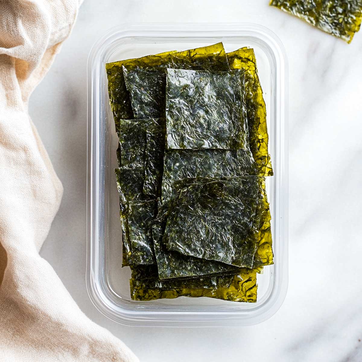 Seaweed snack packed in a reusable contrainer.