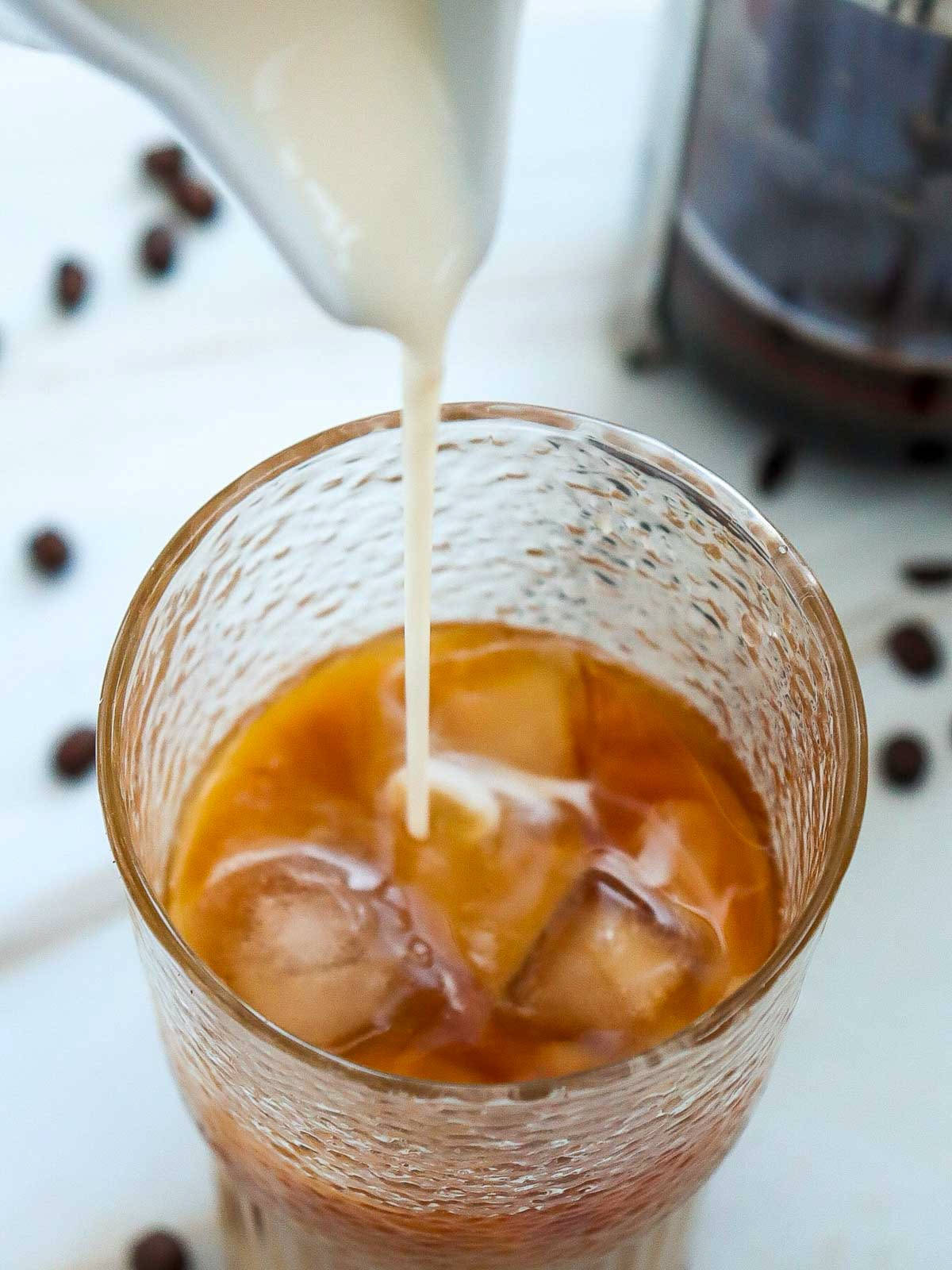 Glass topped with milk.