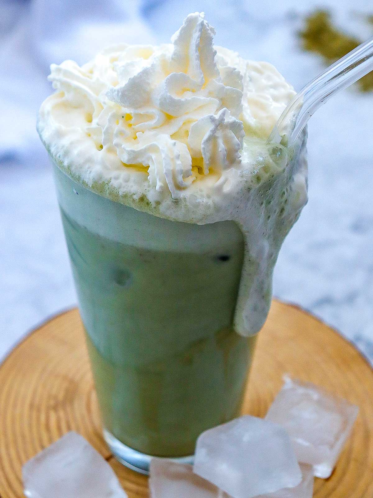 Close up of green tea frappuccino in a tall glass.