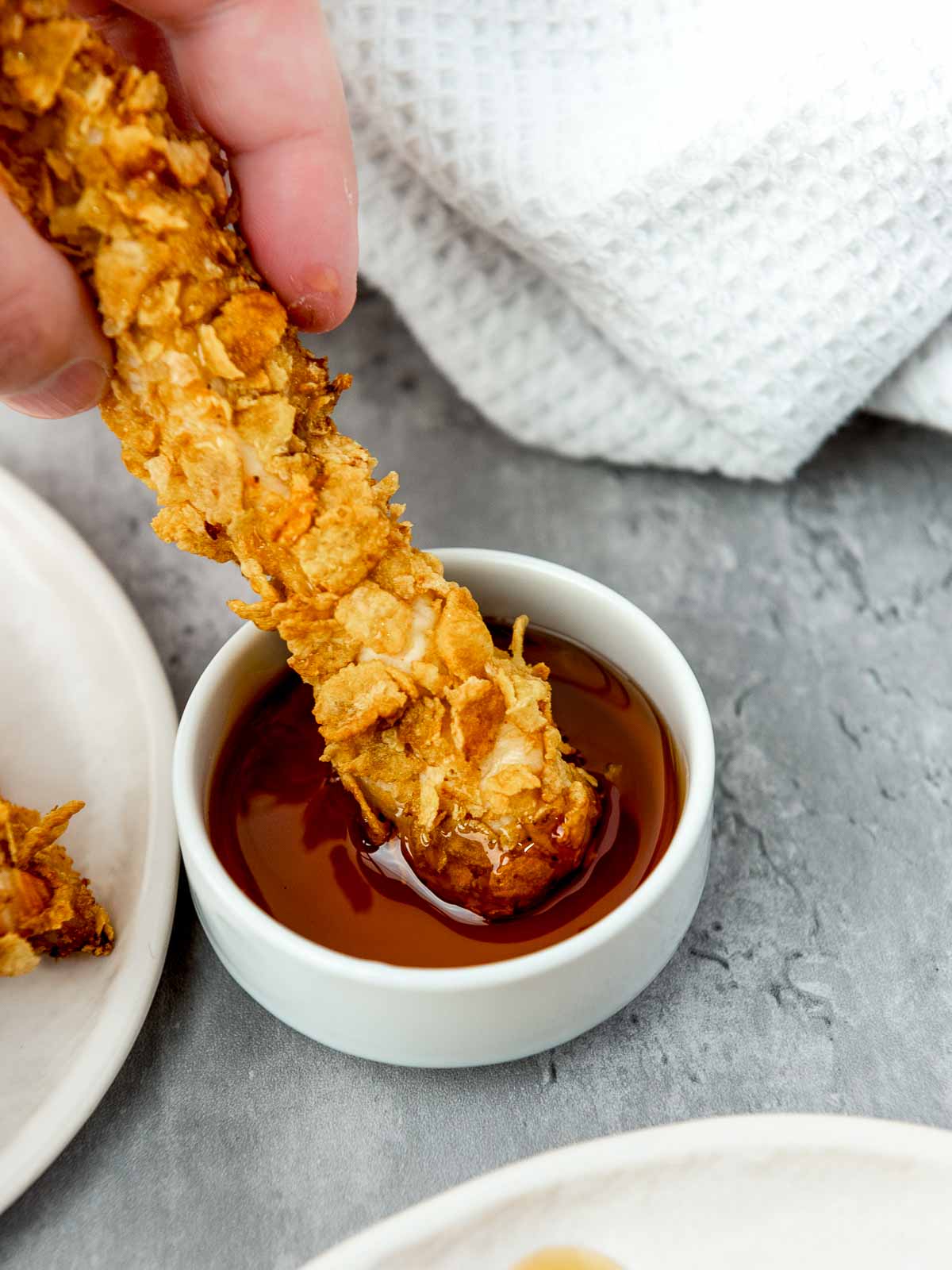 Cornflake chicken dipped in hot honey.