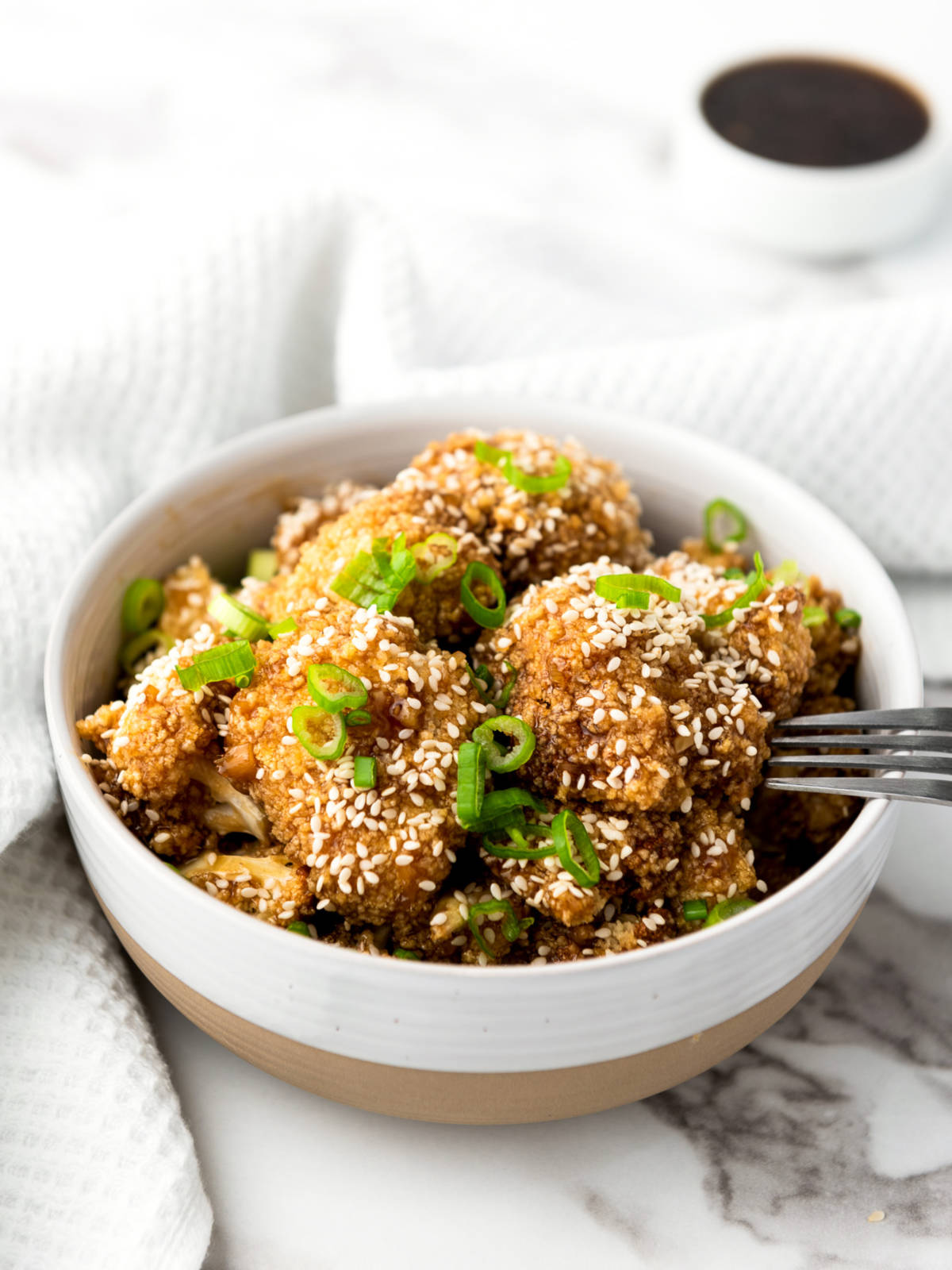 Teriyaki chicken wings in a white bowl.