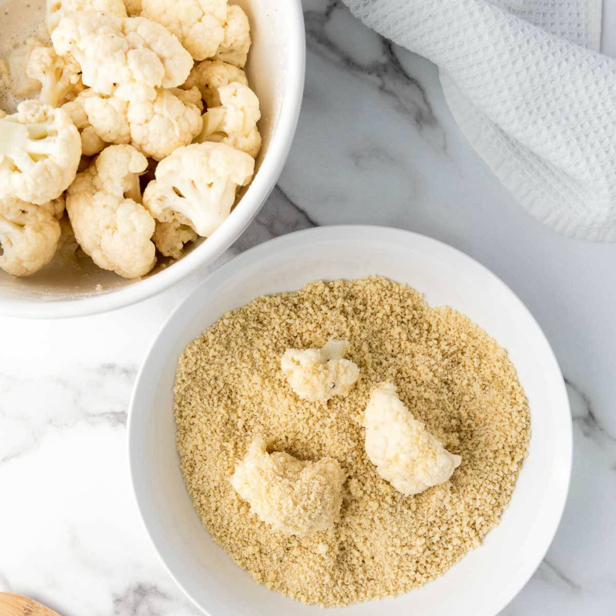 Cauliflower florets dipped in milk and coated in panko.