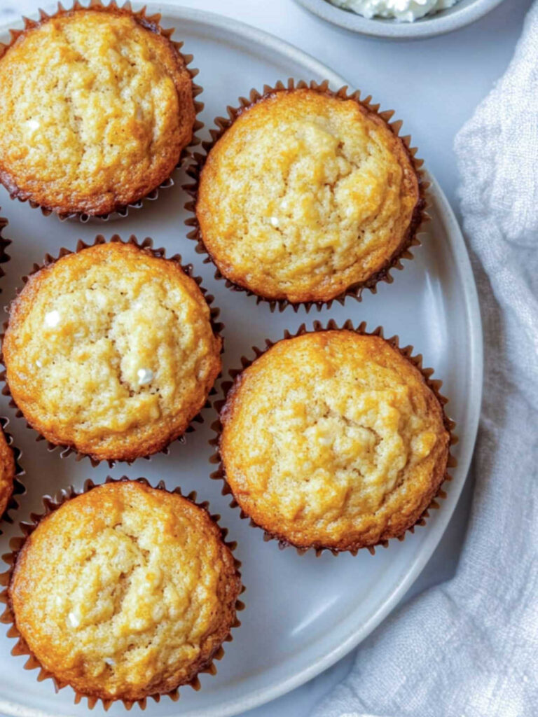 Close up of banana cottage cheese muffins on a white plate.