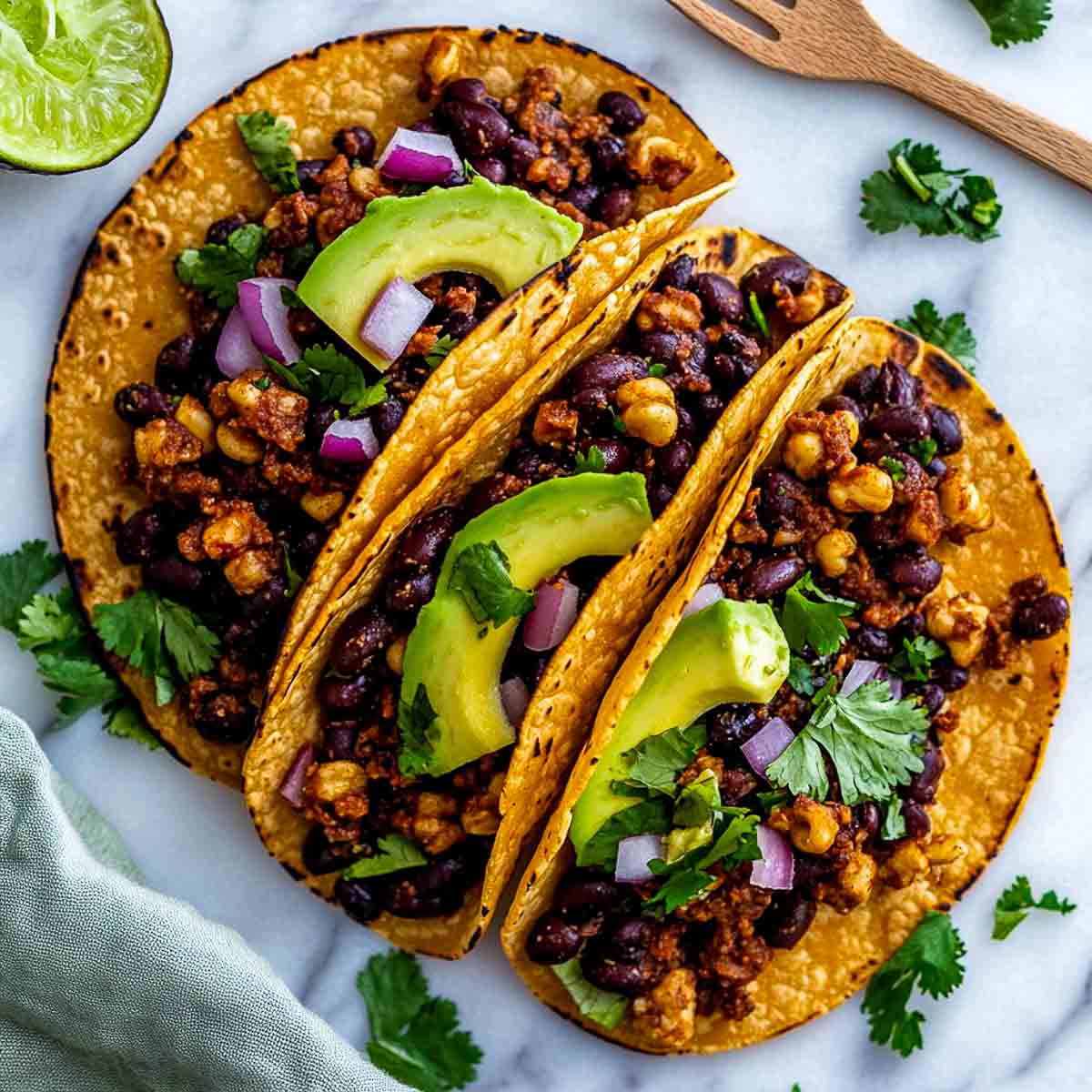 Black bean tacos on a white serving plate.