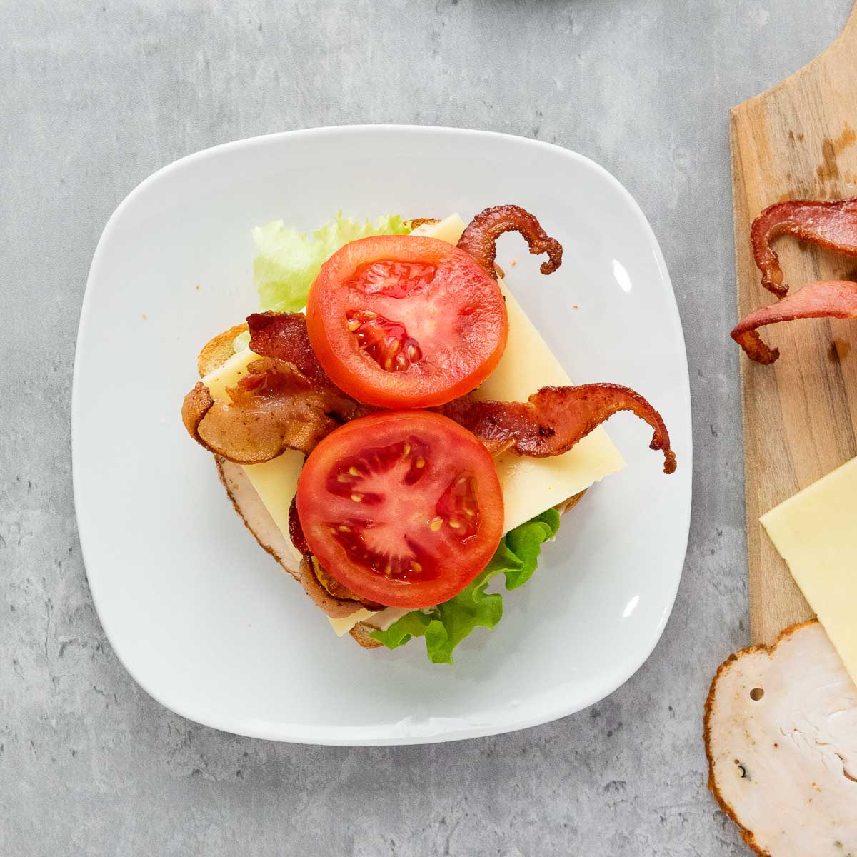 All the other elements topped on the bread.