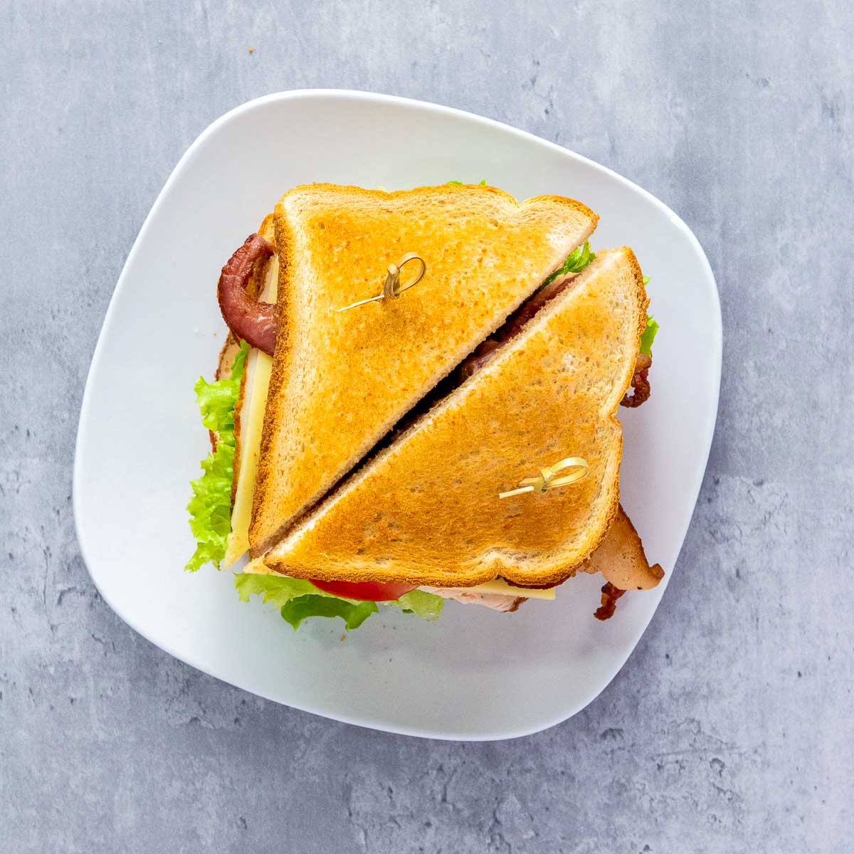 Assembled sandwich secured and sliced.