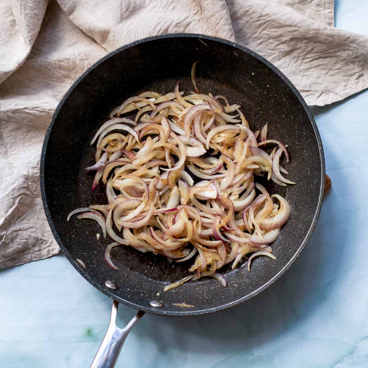 Onion and garlic sauted in skillet.