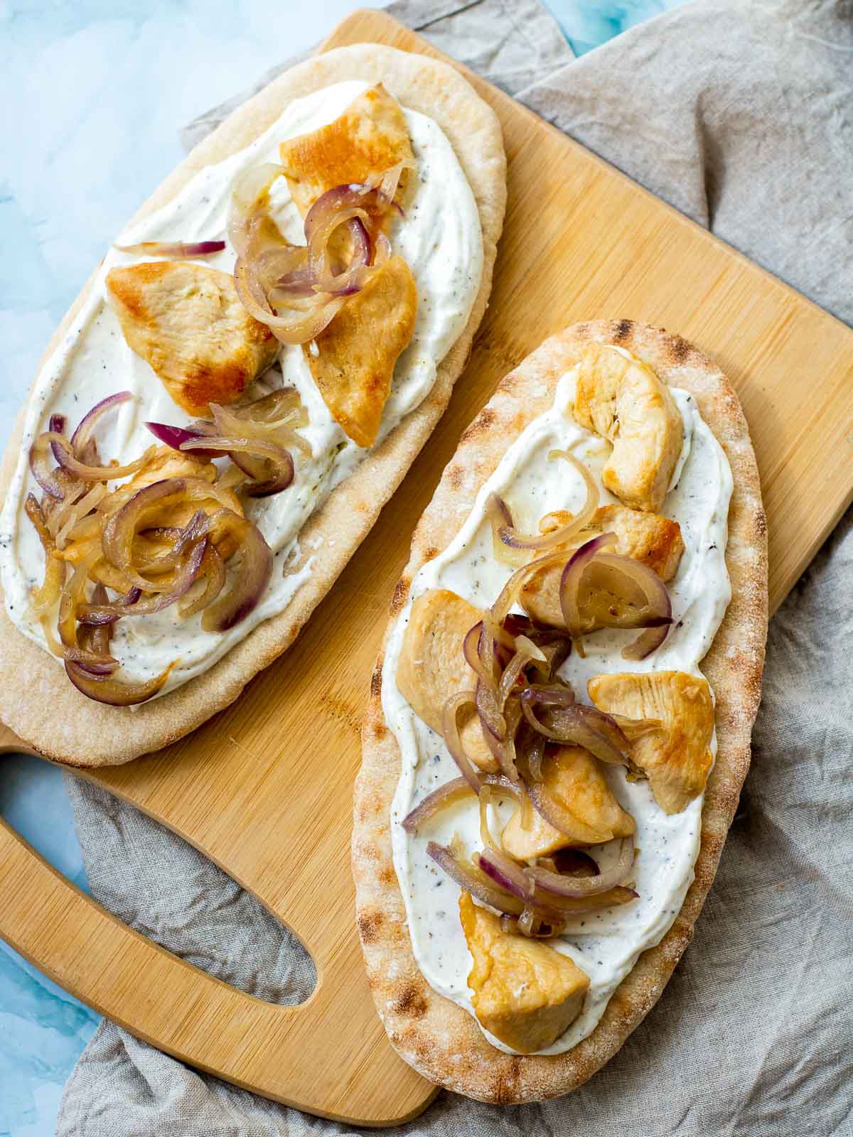 Pita bread assembled on a wooden board.