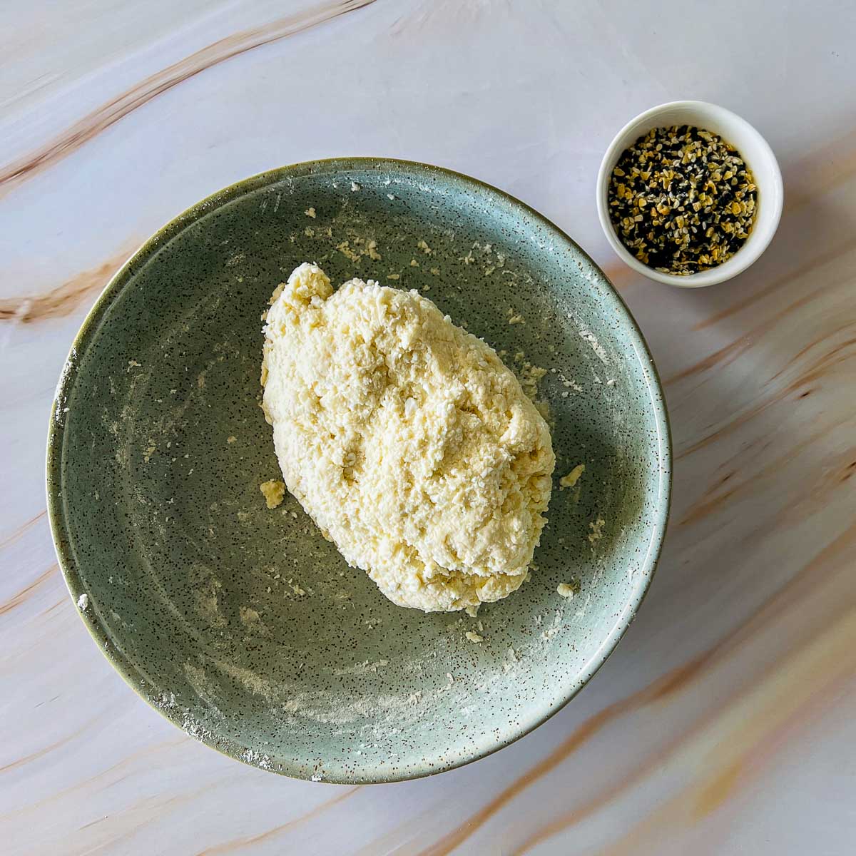 Kneaded dough in a wide bowl.