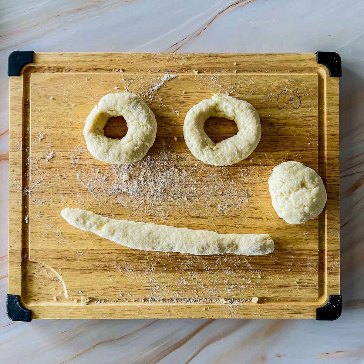 Dough divided into four parts and shaped.