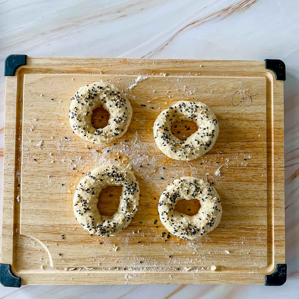 Egg wash and sesoning on the bagels.