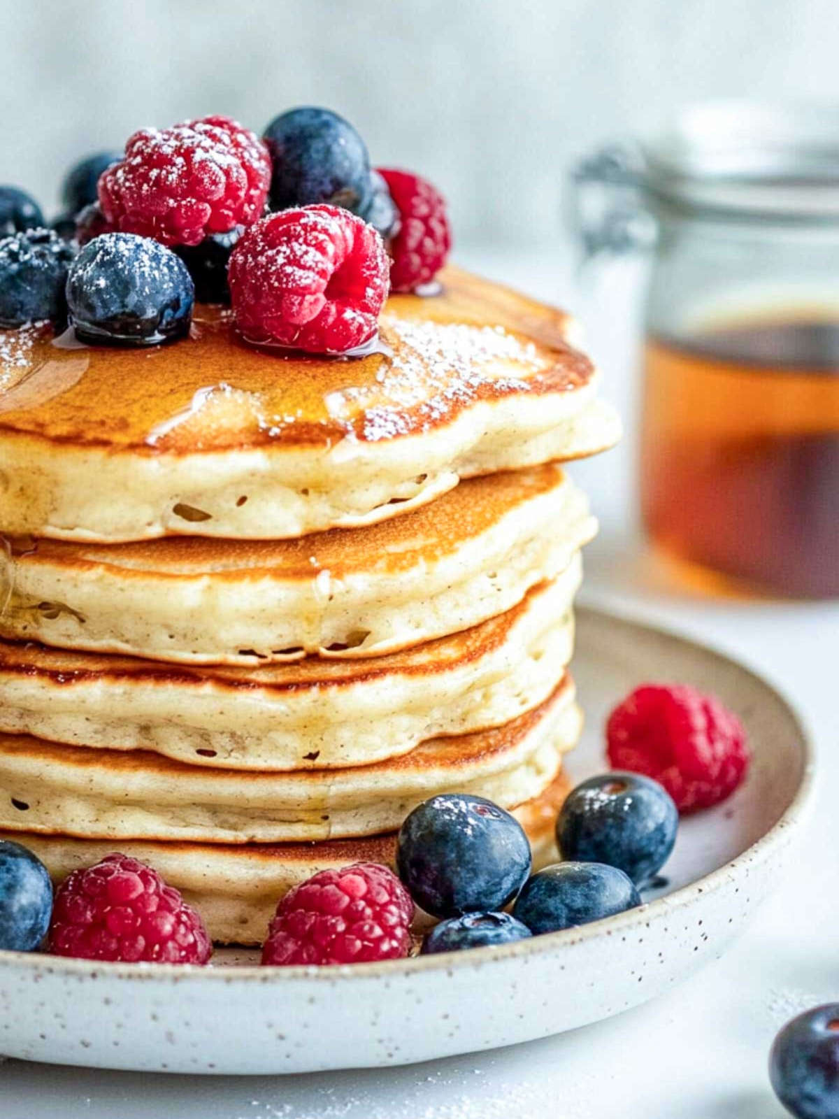 Close up of cottage cheese pancakes served with honey.