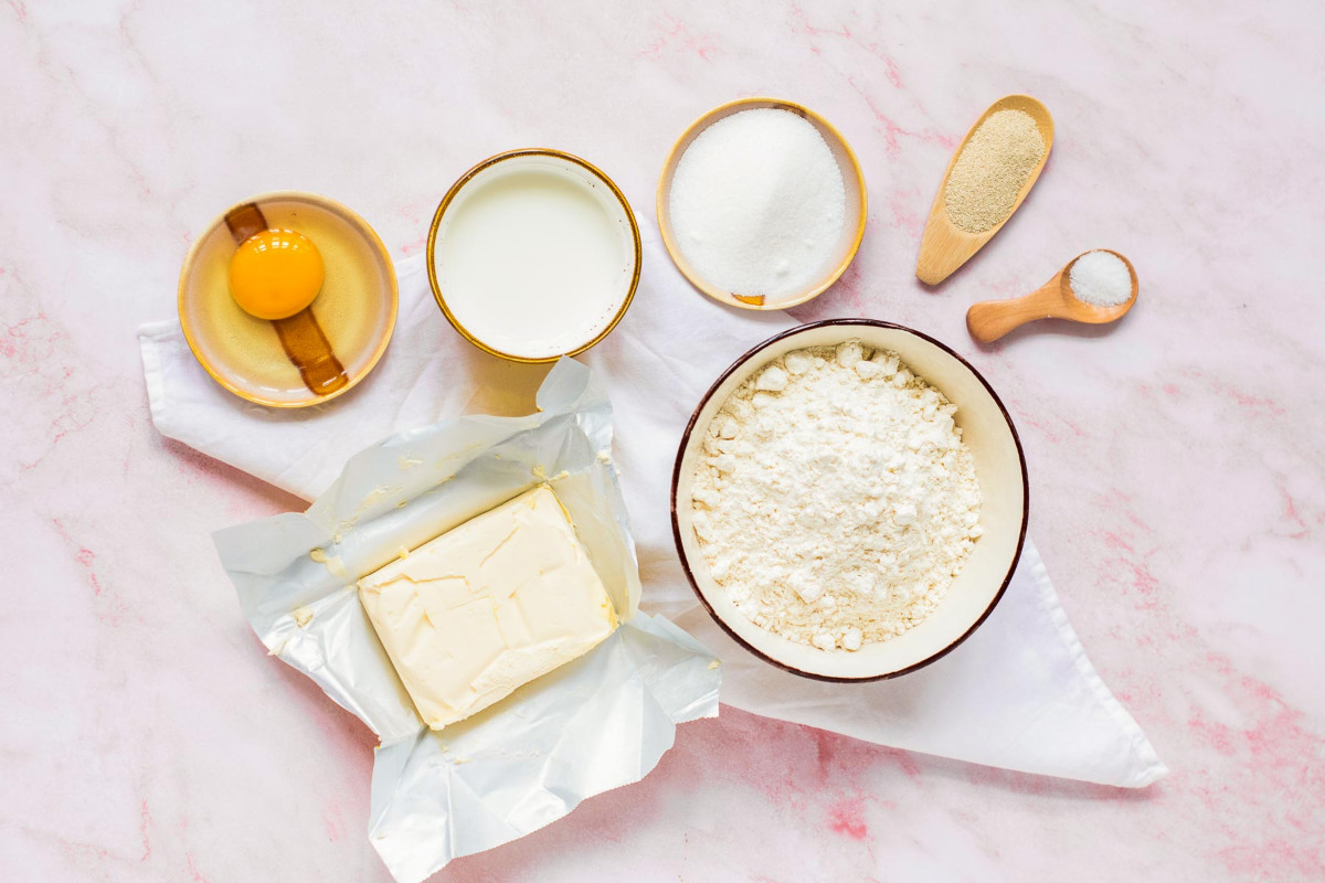 Ingredients placed on a pink marble surface.