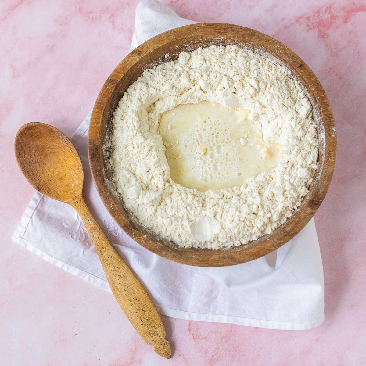 Flour and yeast mixture in a large mixing bowl.