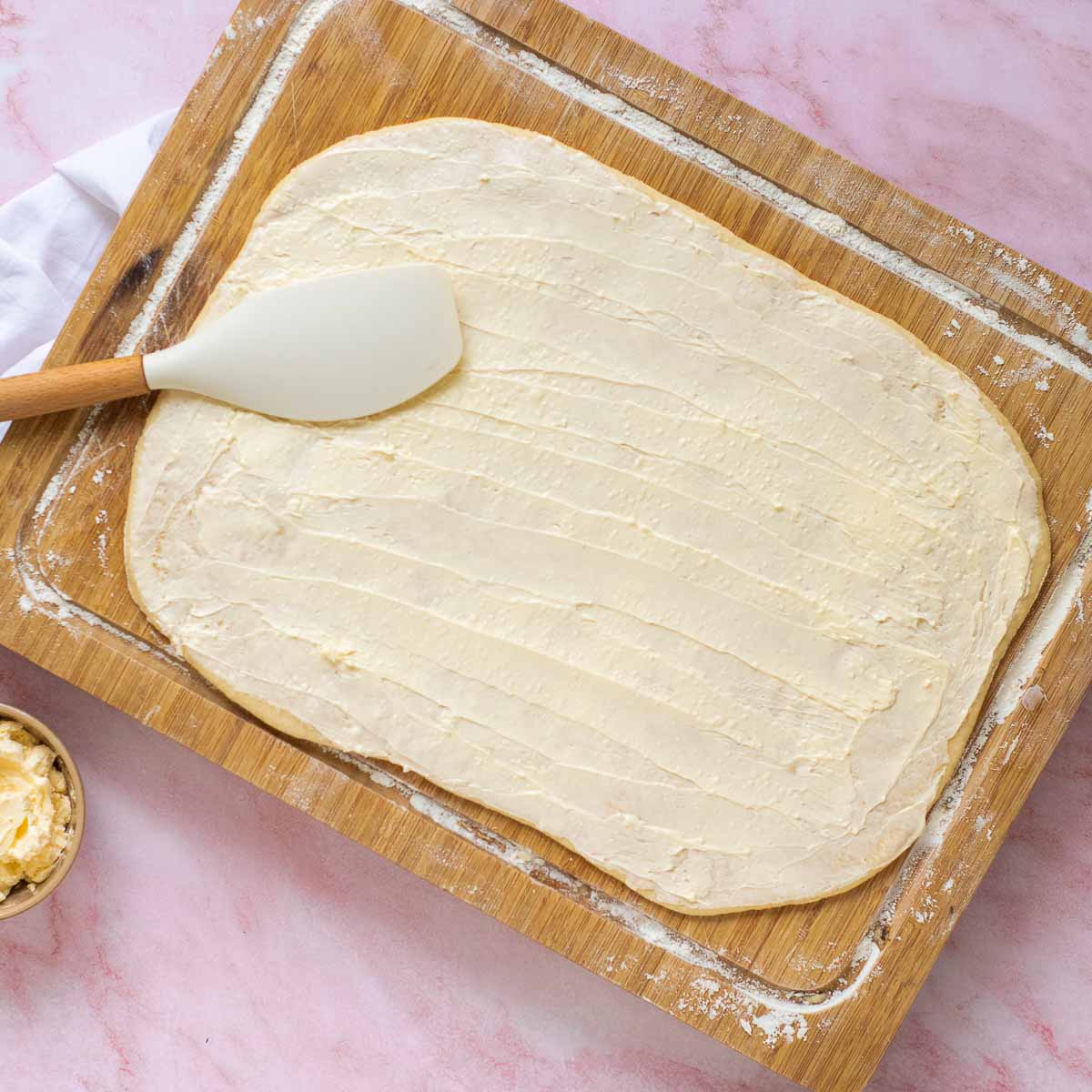 Dough rolled into a rectangle and brushed with butter.