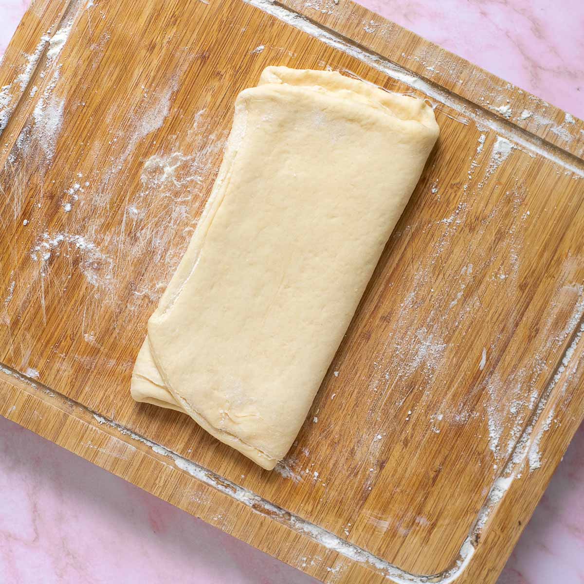 Dough folded by bringing the sides together.