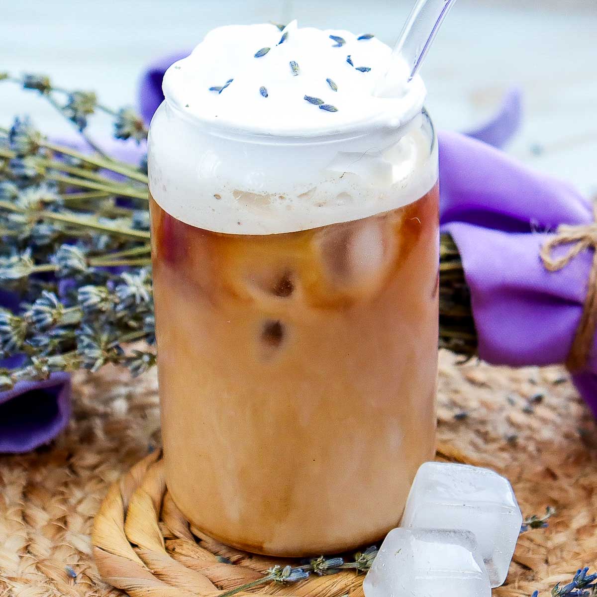 Side view close up of lavender iced coffee showing the layers.