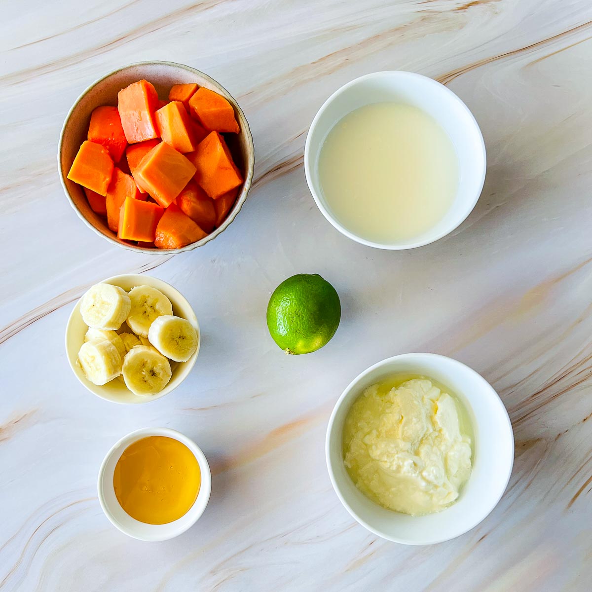 Ingredients placed on a marble surface.