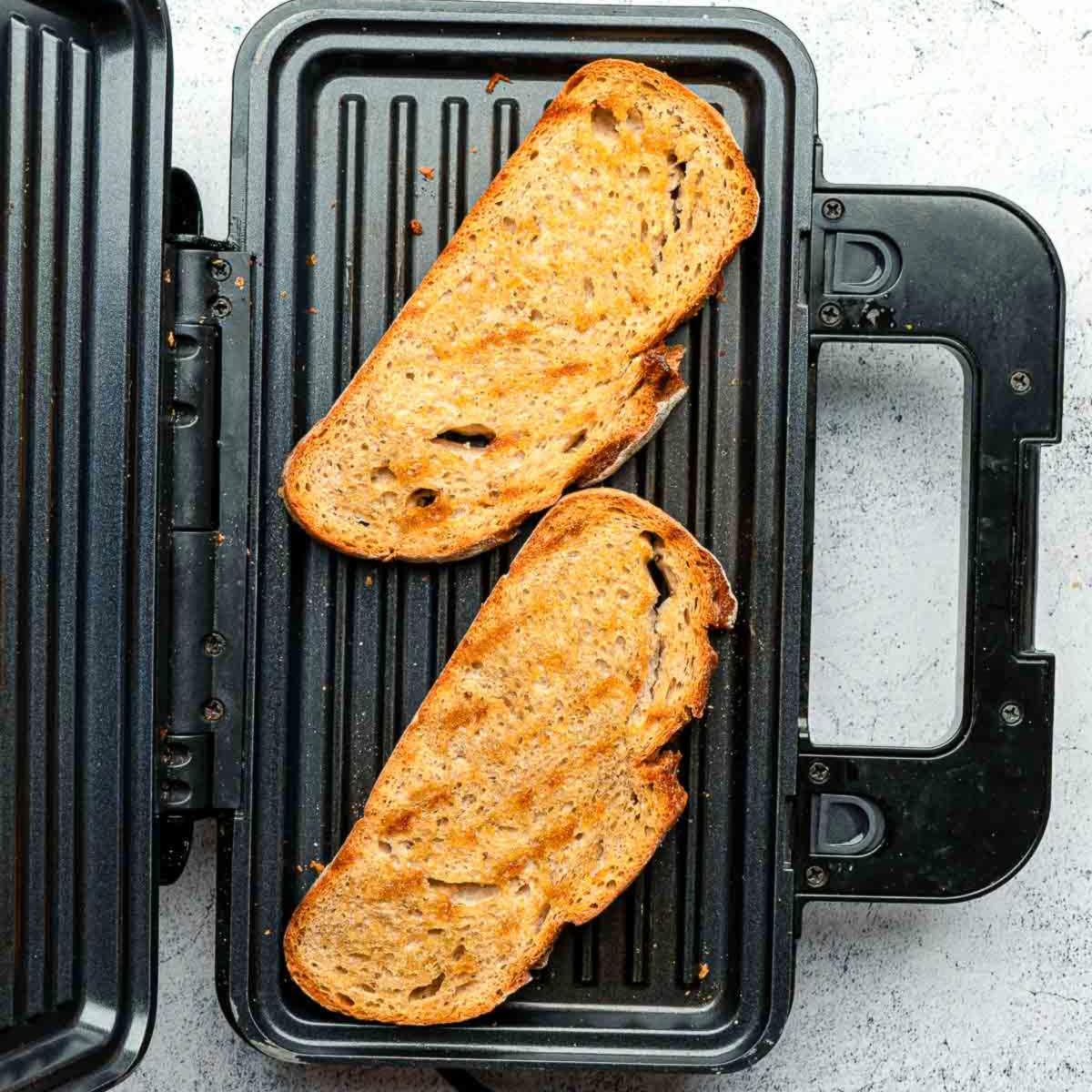 Toasted sourdough slices on toaster.