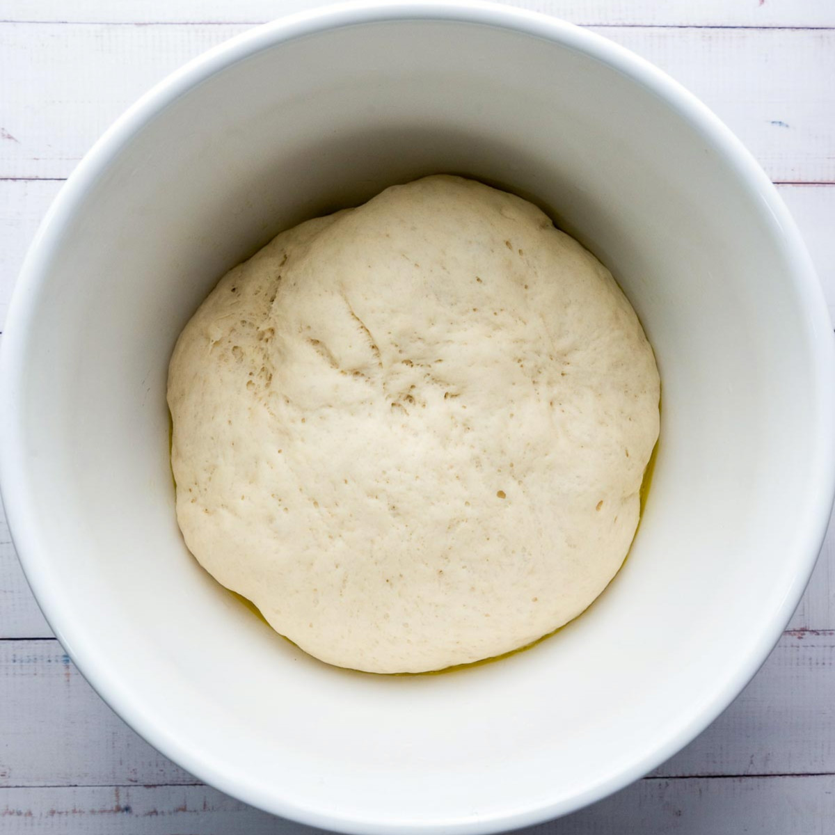 Dough risen and doubled in size after resting.