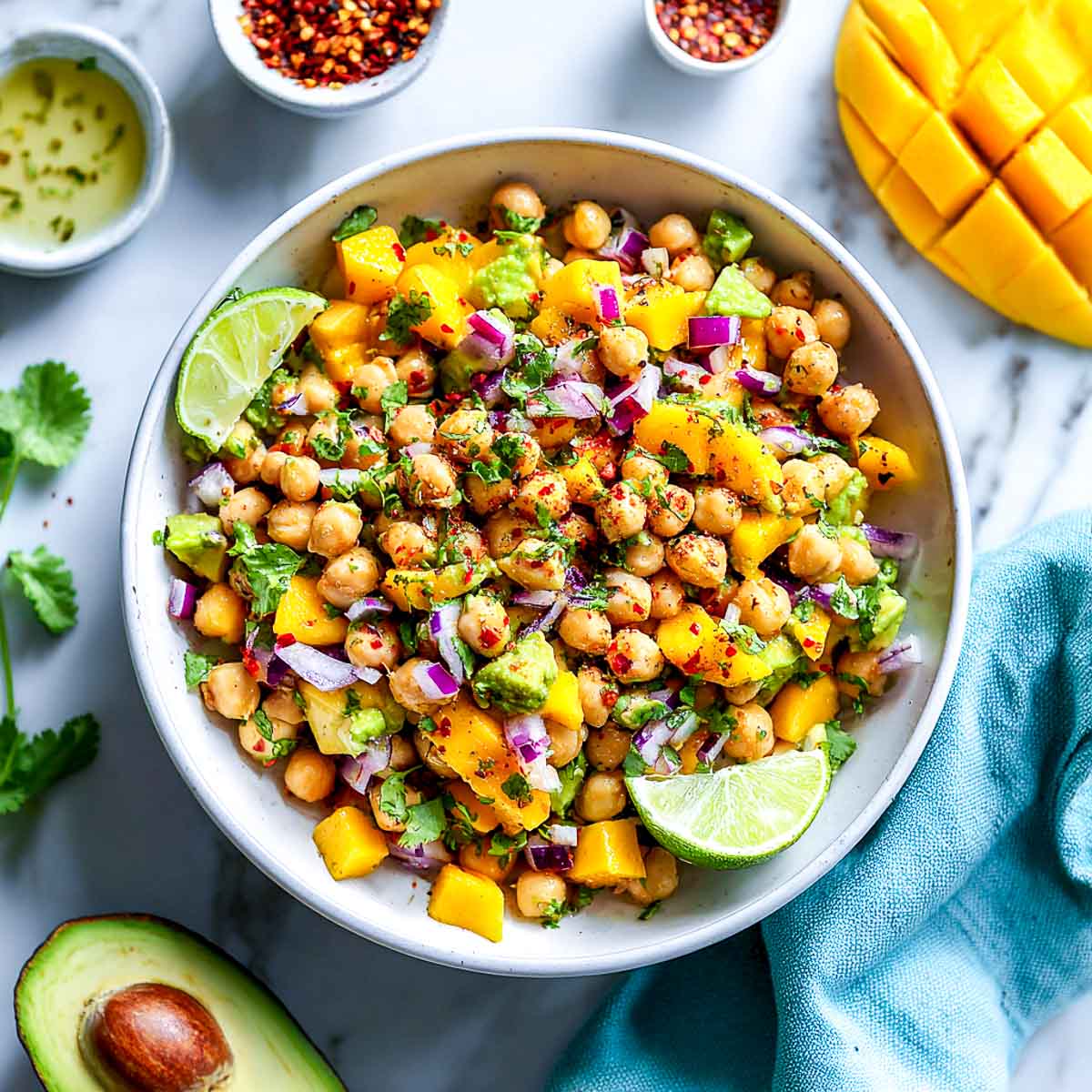 Chickpea salad with mango, avocado, red onion, lime, and chili flakes.