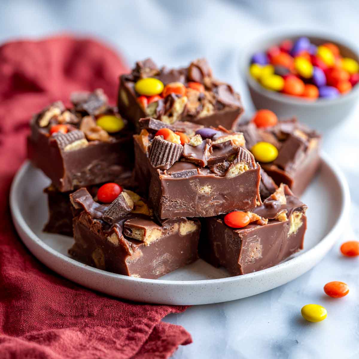 Chocolate fudge squares topped with assorted Halloween candy pieces.
