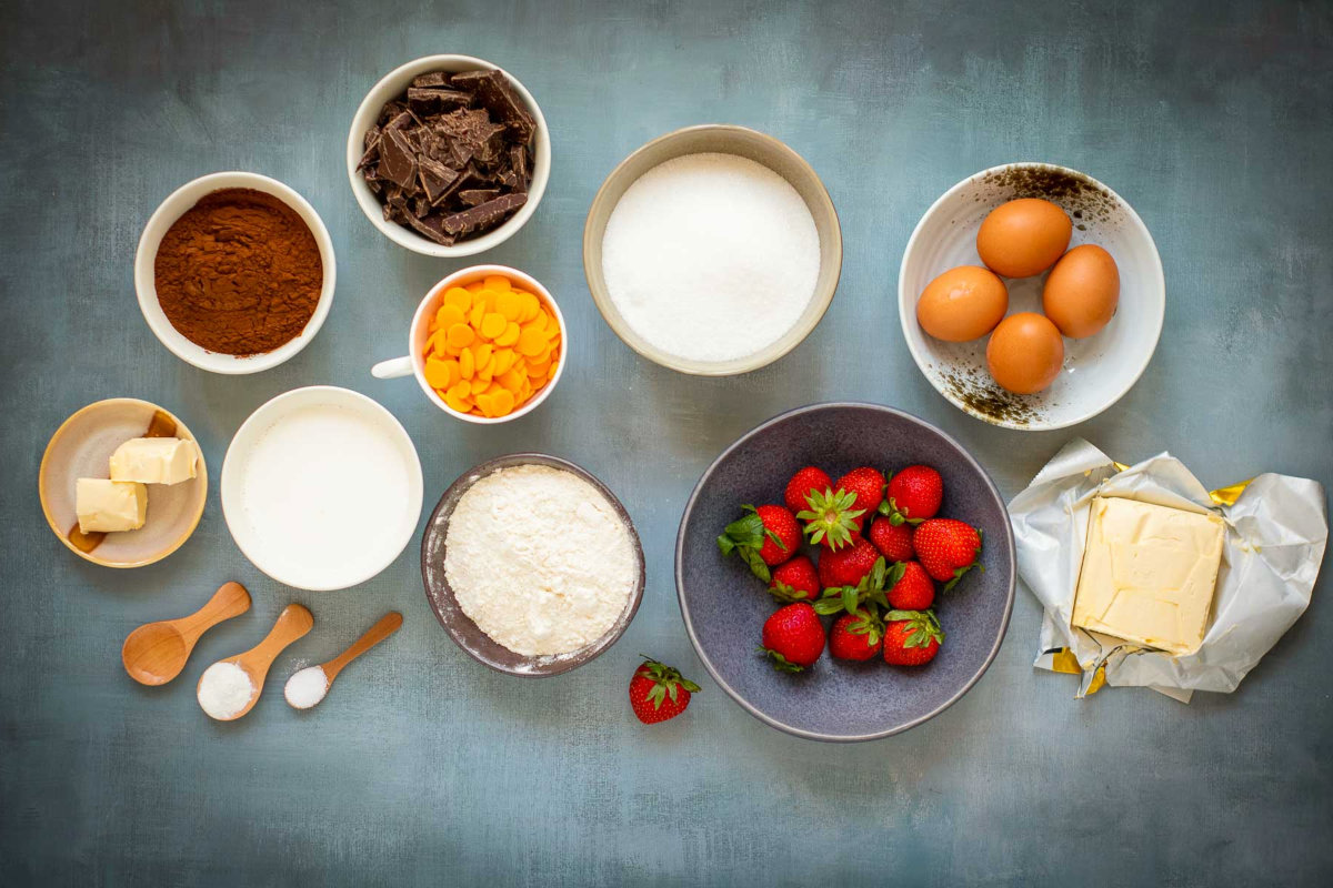 Overhead view of measured brownie cake ingredients.