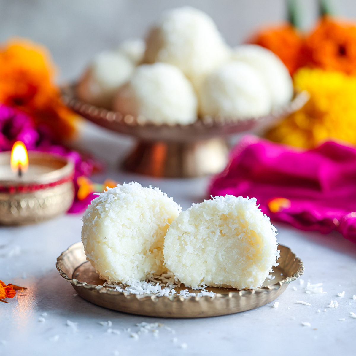 Close up of ladoo broken into two pieces to show the texture.