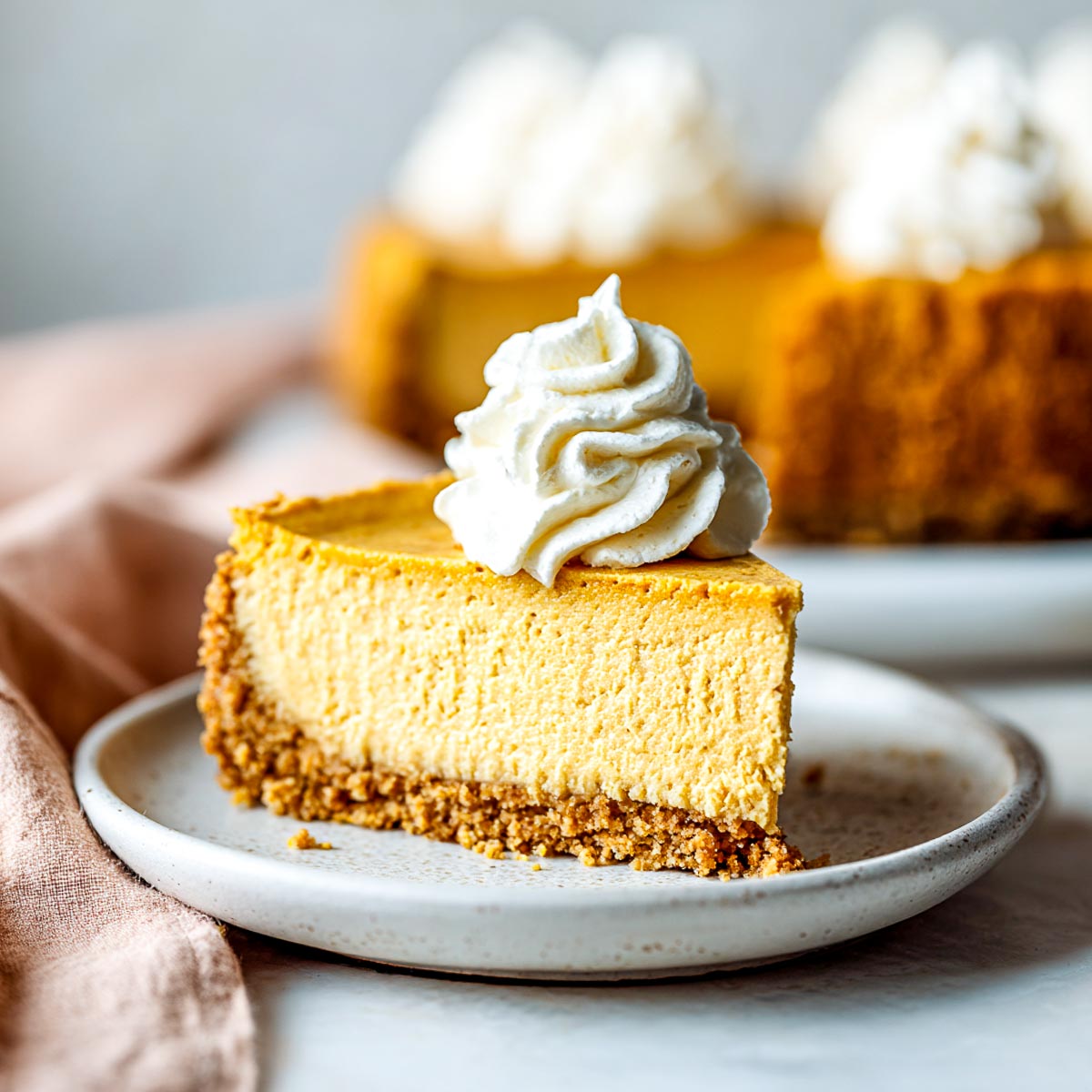 Pumpkin dessert baked in the air fryer and placed on a white serving plate.