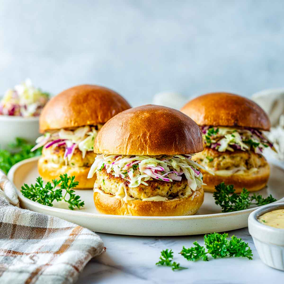 Maple apple chicken burgers with crunchy slaw on brioche buns.