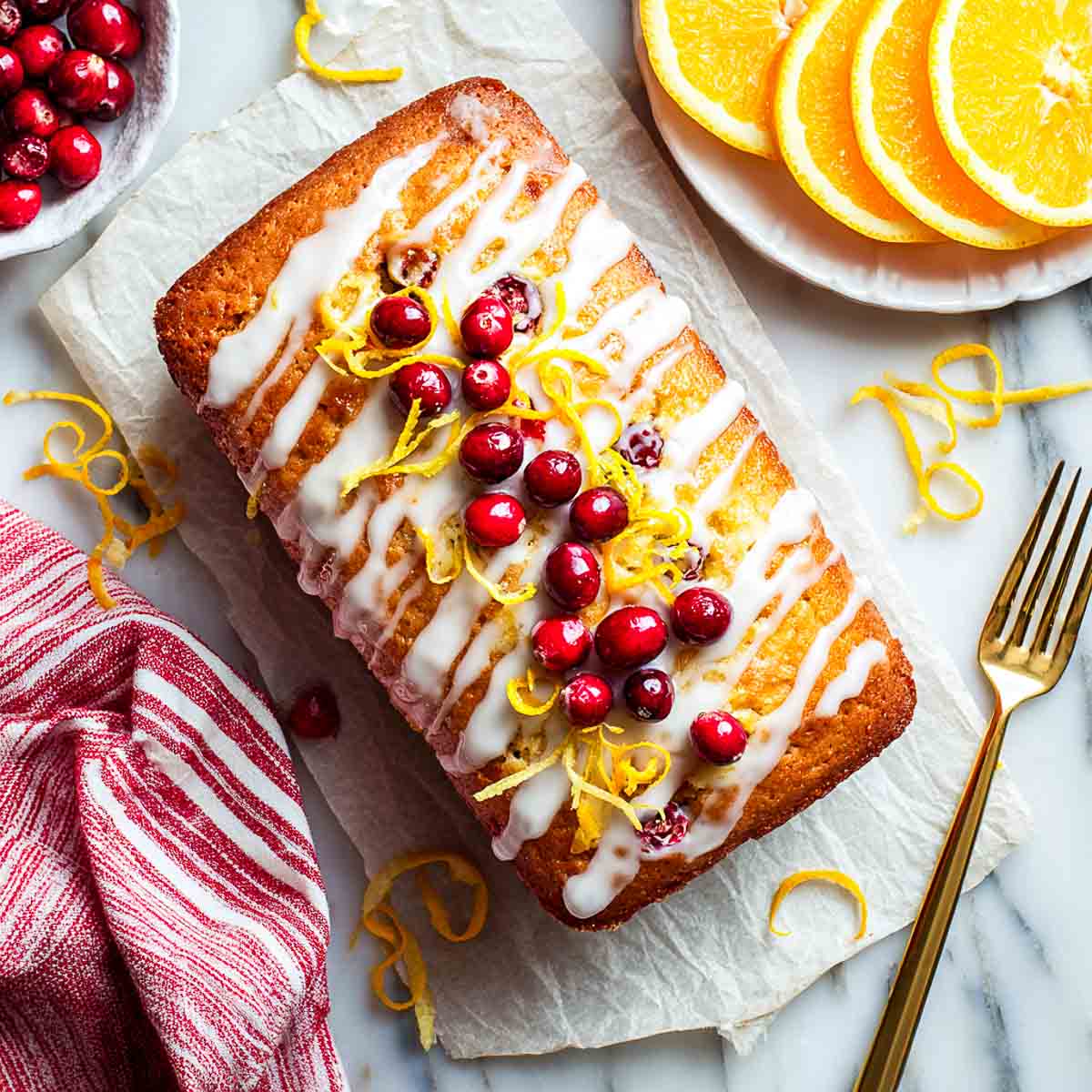 Cranberru orange cream cheese pound loaf with glaze.